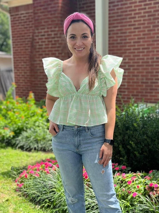 Ruffle tie in back blouse